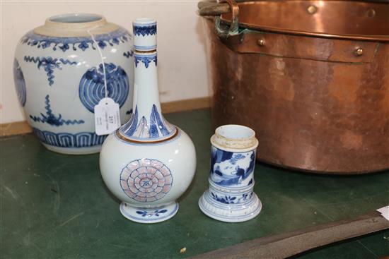 A Chinese blue and white jar, a similar pot and in underglaze blue and copper red vase, Kangxi and later